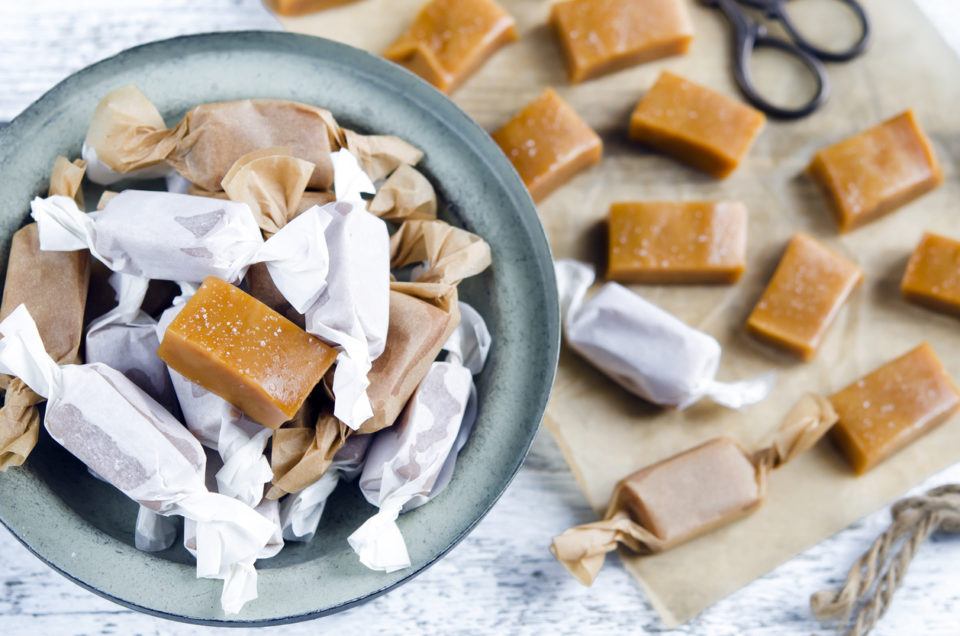 Sweet caramel toffee caramels on wooden table