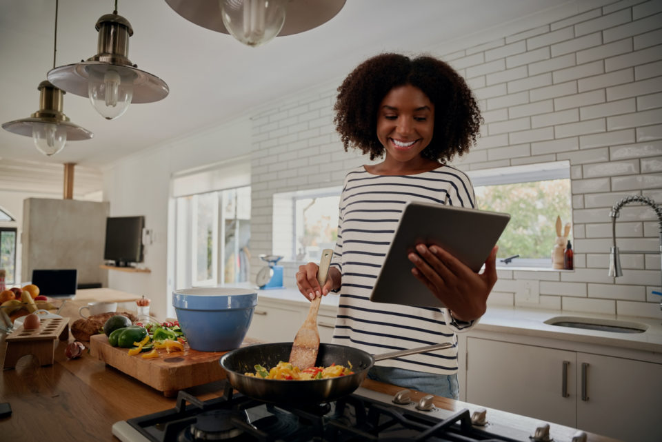 Woman watching recipe in digital tablet