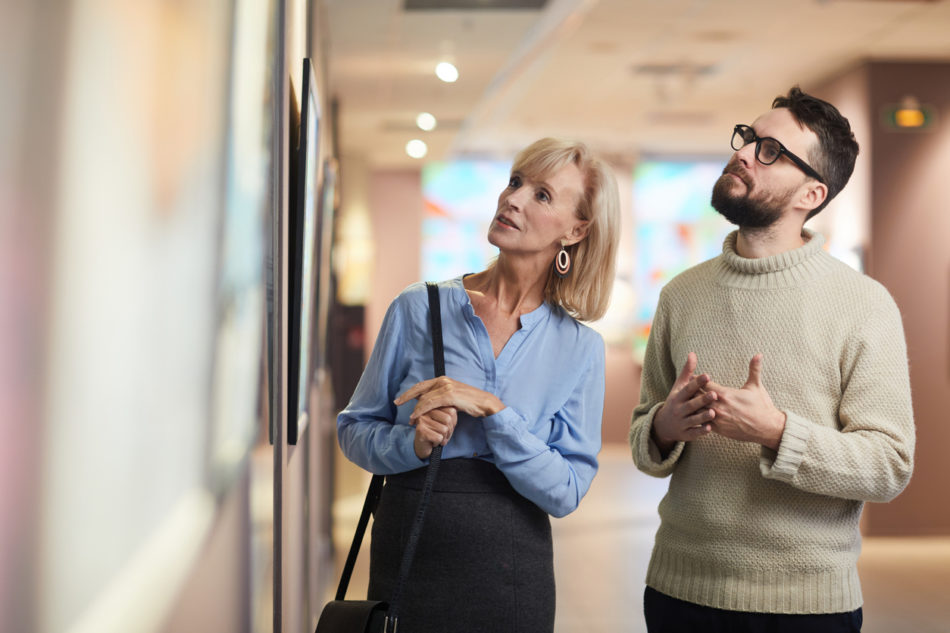 Mature Couple Enjoying Art Exhibition in Museum