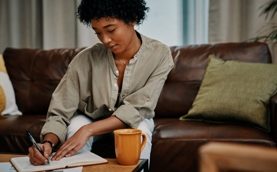 woman writing in journal