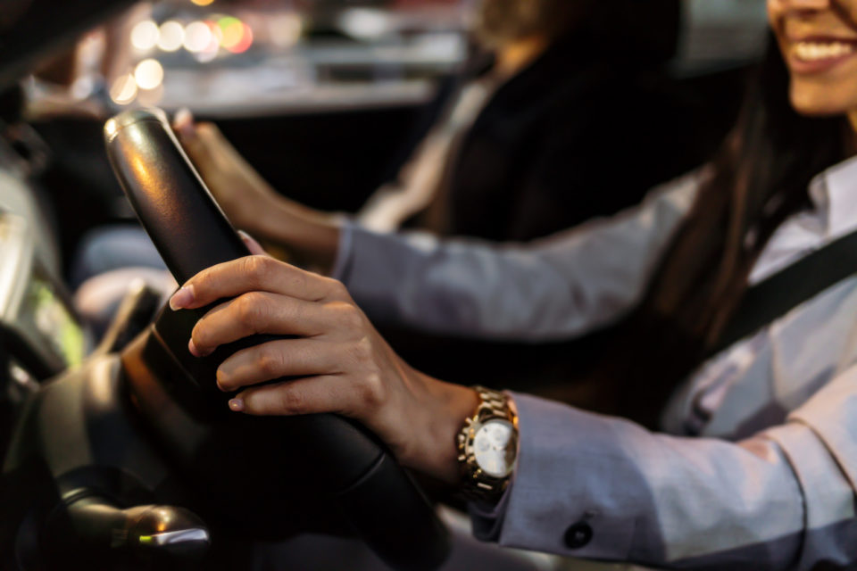 woman hands driving a car