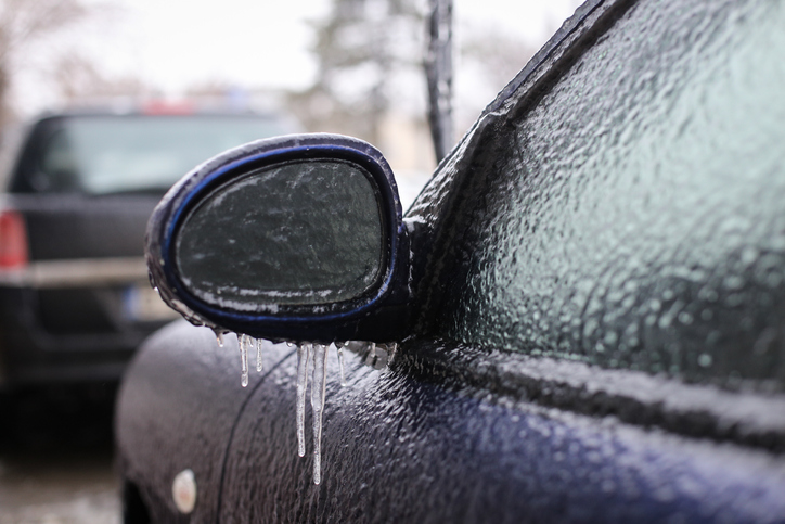 Car frozen side mirror after a freezing rain phenomenon