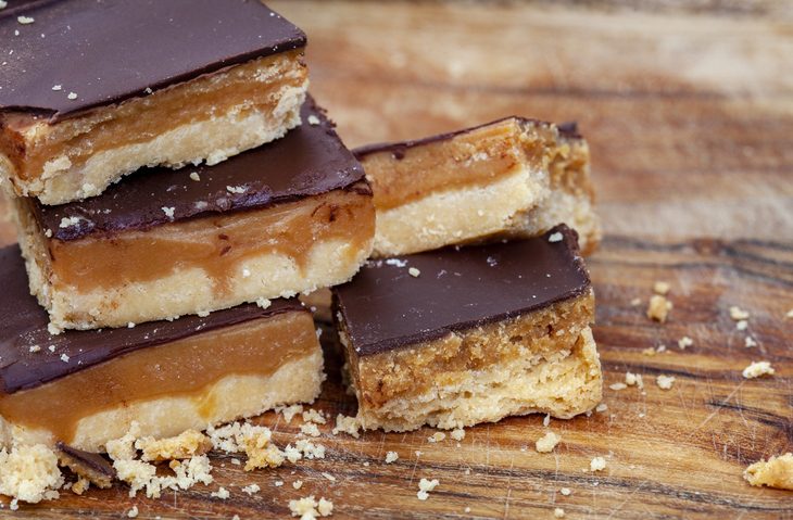 Rustic style millionaires’ shortbread blocks with crumbs