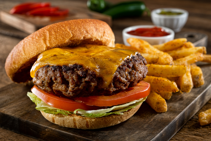 A delicious homemade burger with real cheddar cheese and black pepper seasoned French fries.