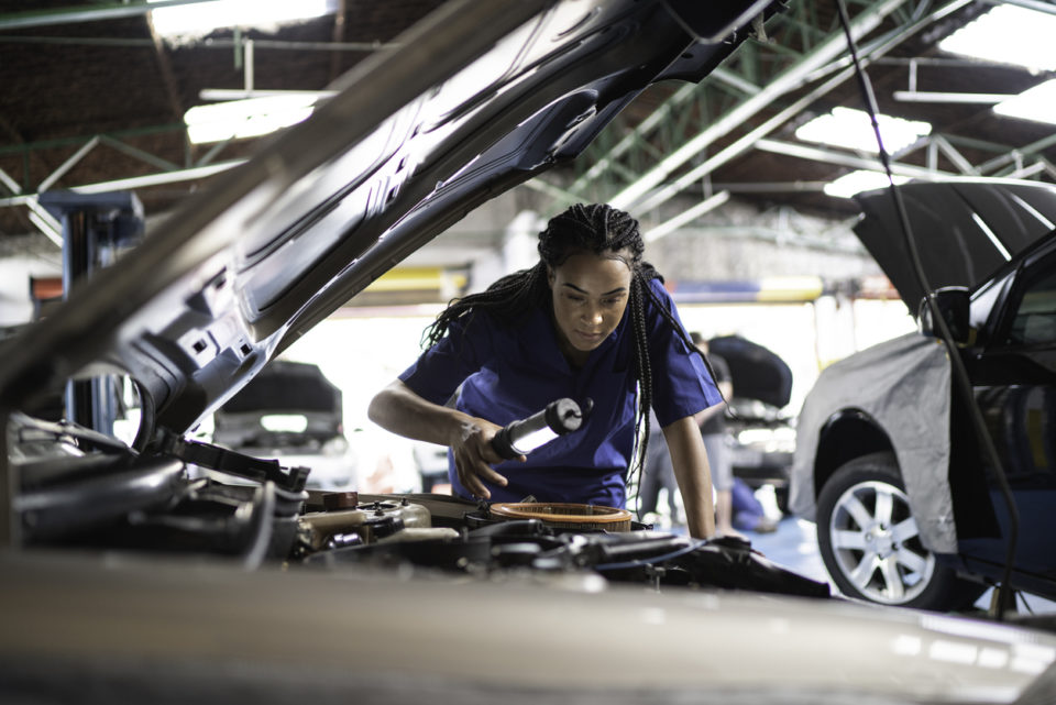 Woman looking at engine