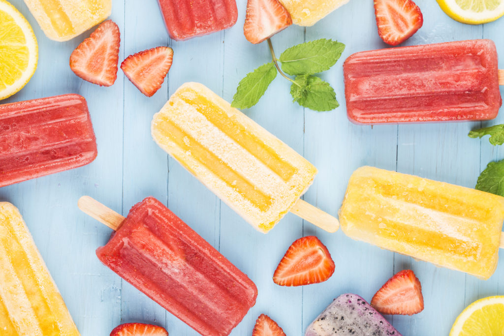 colorful popsicles with herbs and berries